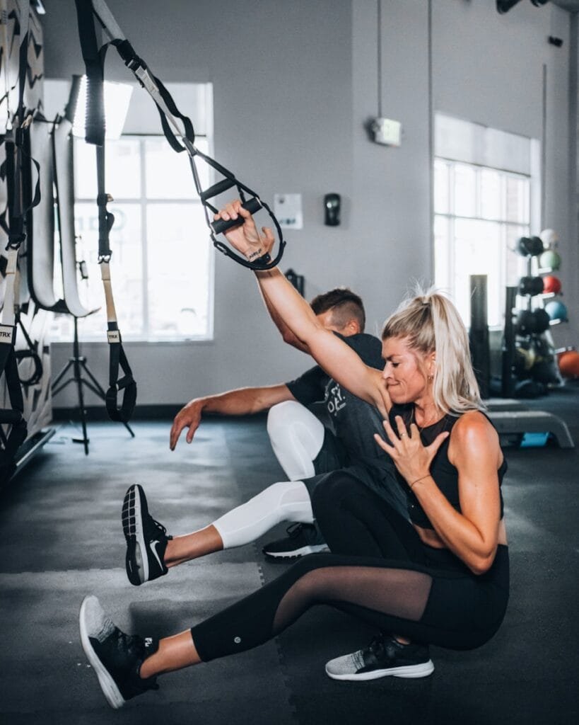 Ultimate Numerology And Fitness Guide 8 Ultimate Numerology And Fitness Guide woman in black tank top and white pants sitting on floor