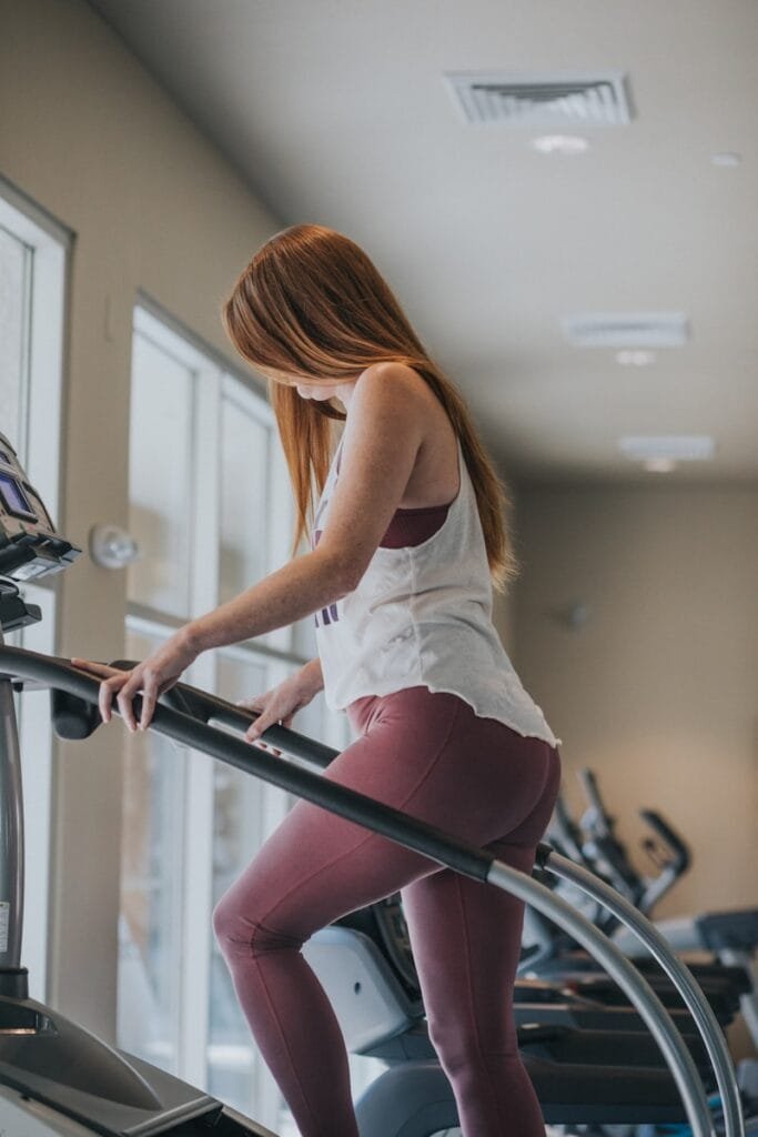 Ultimate Numerology And Fitness Guide 4 Ultimate Numerology And Fitness Guide woman wearing white tank top exercising on gym equipment